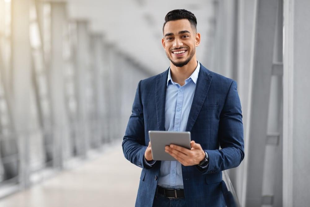 Smiling,Young,Middle,Eastern,Man,With,Digital,Tablet,In,Hands